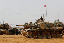 Turkish army tanks and military personal are stationed in Karkamis on the Turkish-Syrian border in the southeastern Gaziantep province, Turkey, August 25, 2016. REUTERS/Umit Bektas/File Photo -