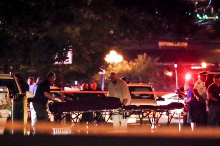 Bodies are removed from at the scene of a mass shooting, Sunday, Aug. 4, 2019, in Dayton, Ohio. Several people in Ohio have been killed in the second mass shooting in the U.S. in less than 24 hours, a