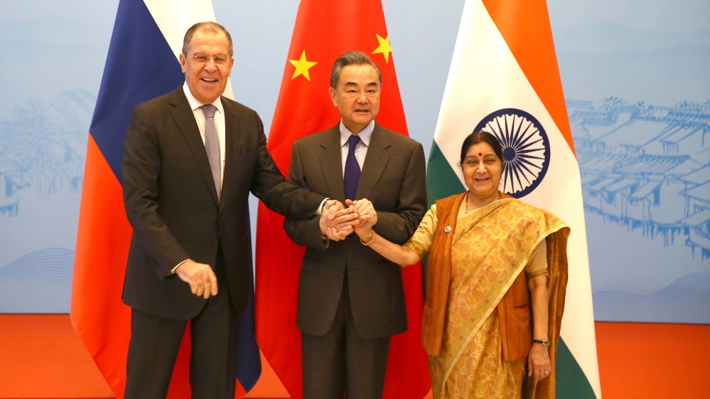 Russian Foreign Minister Sergei Lavrov,  Chinese State Councillor and Foreign Minister Wang Yi and Indian External Affairs Minister Sushma Swaraj pose for a photo before their meeting in Wuzhen