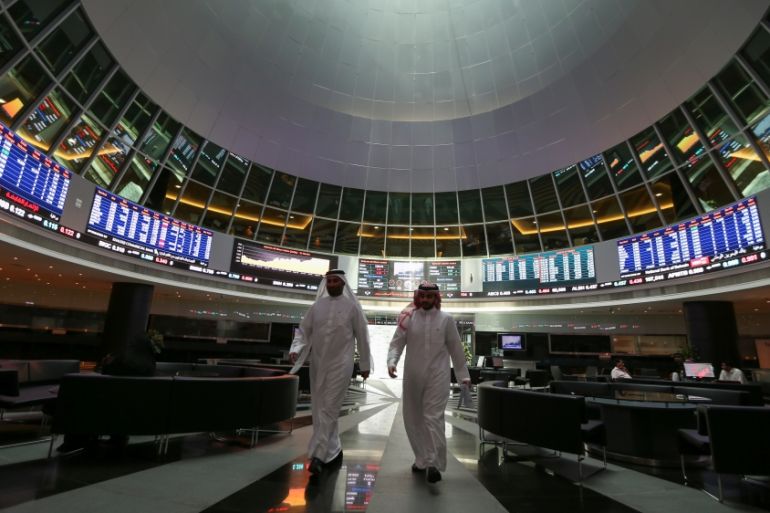 Traders walk out of Bahrain Bourse in Manama