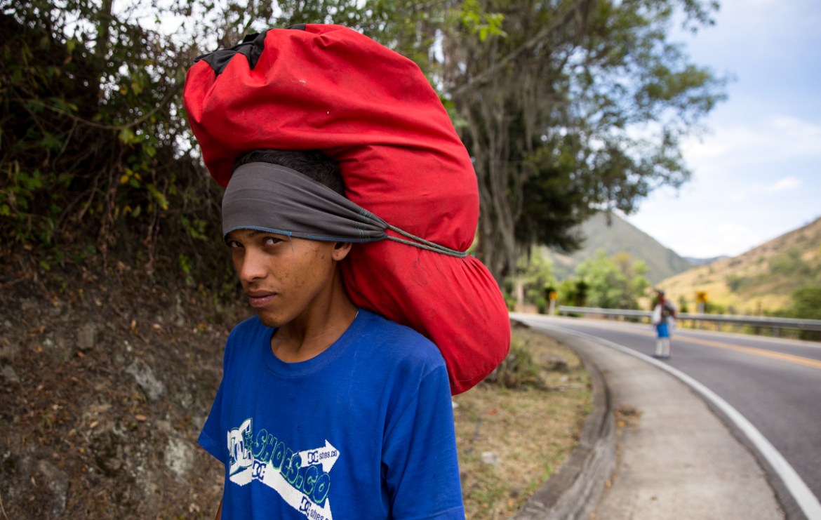 Joel Pino, a 23-year-old migrant from Valencia, Venezuela, lived eight months in Cucuta´, Colombia, working as a "trochero," carrying migrants'' bags through illegal pathways running between the two co