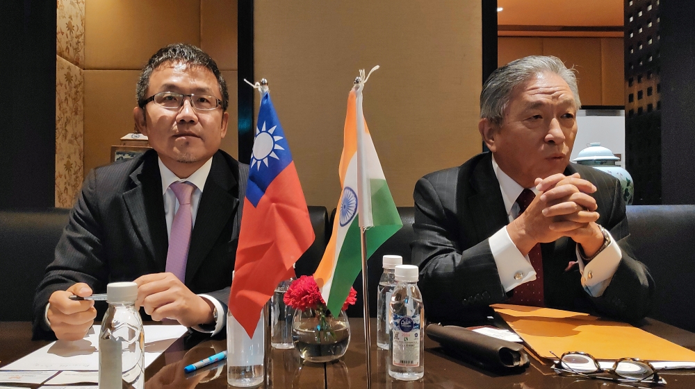 Shih-Chung Liu and Chung-Kwang Tien attend a news conference in New Delhi
