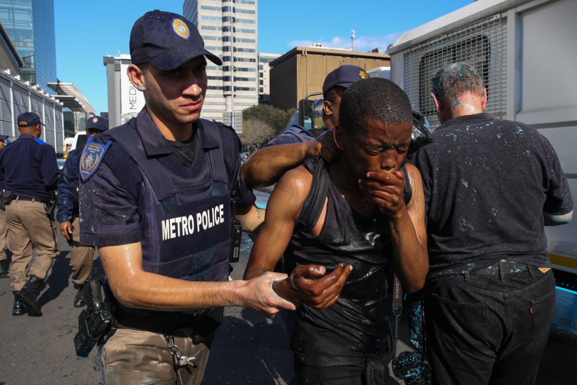 A protester is arrested near the CTICC where the WEF is taking place. 11 students, 8 females and 3 males were arrested for public violence according to the South African Police Service.