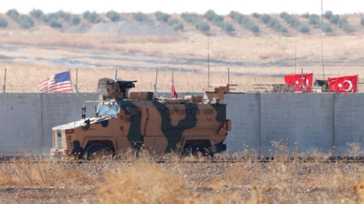 A Turkish military vehicle is seen next to the border walls during a joint U.S.-Turkey patrol in northern Syria, as it is pictured from near the Turkish town of Akcakale
