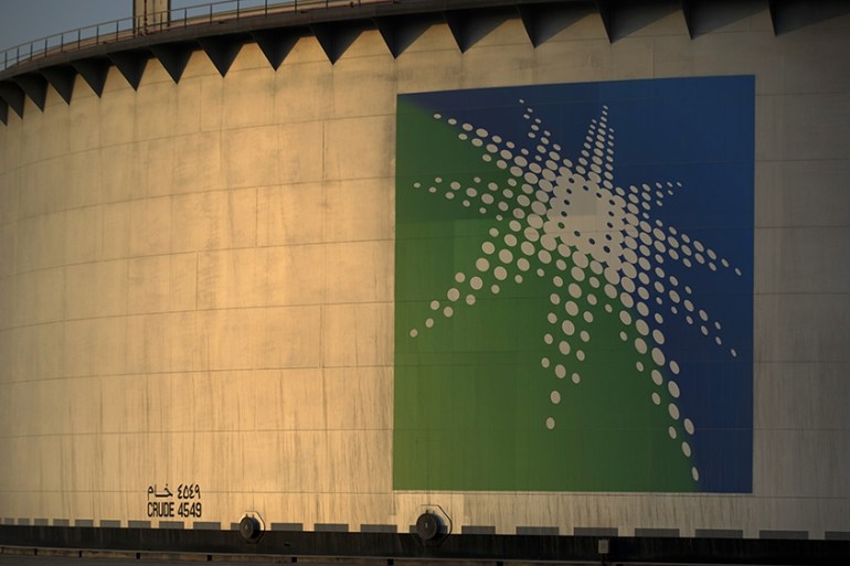 A logo sits on display outside an oil storage tank in the Juaymah tank farm at Saudi Aramco''s Ras Tanura oil refinery and terminal at Ras Tanura, Saudi Arabia, on Monday, Oct. 1, 2018