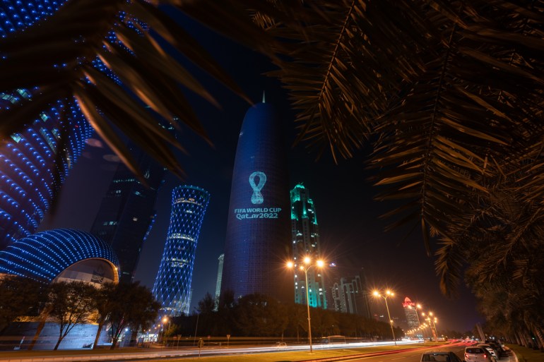 World Cup Logo projected on Doha Tower [Sorin Furcoi/Al Jazeera]