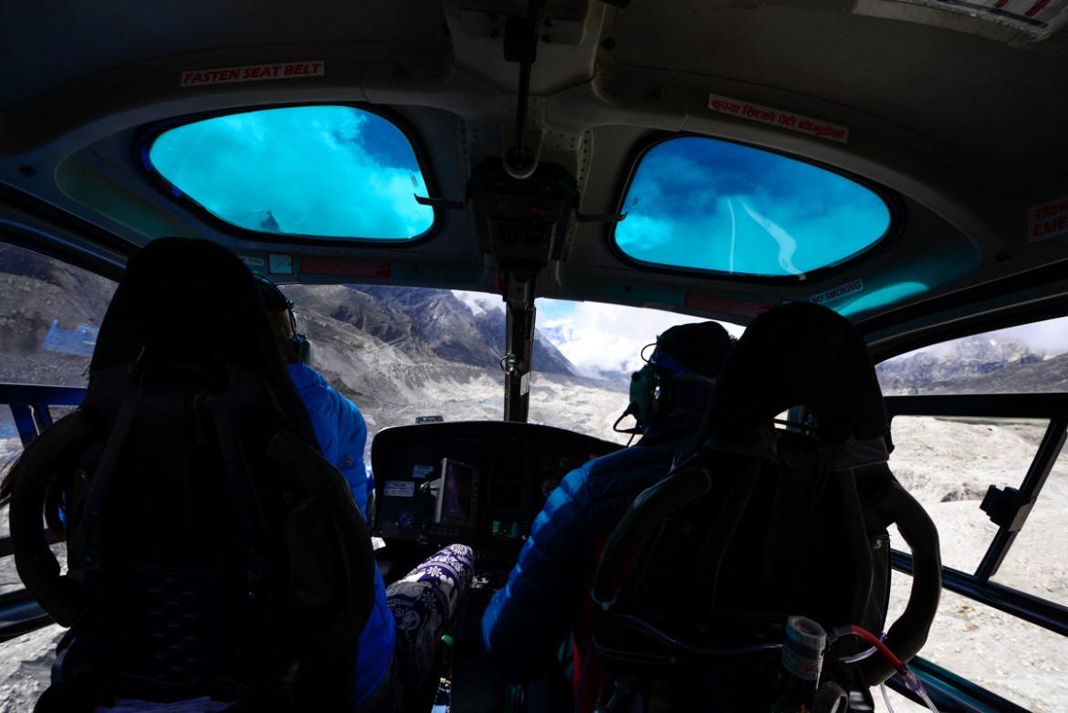 On the final approach to EBC, pilots fly low over the tongue of the Khumbu Glacier carving through the bedrock. Hugging the glacier gives a close-up inspection of the ice’s health, which recent core s