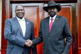 South Sudan first Vice President Dr Riek Machar, left, greets South Sudan President Salva Kiir, right, in Juba, South Sudan [File: Sam Mednick/AP Photo]