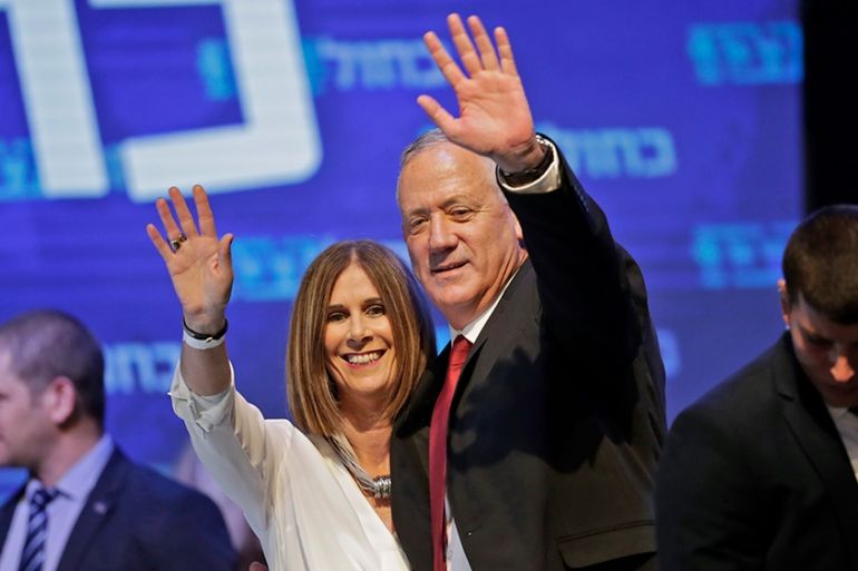 Benny Gantz (C-R), leader and candidate of the Israel Resilience party that is part of the Blue and White (Kahol Lavan) political alliance, waves to supporters alongside his wife Revital Gantz (C-L) a