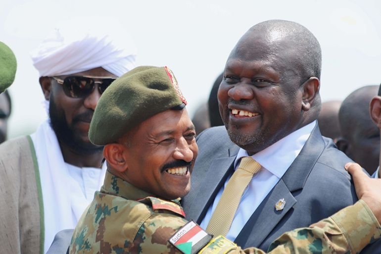South Sudan''s ex-vice president and former rebel leader Riek Machar is greeted by a Sudanese army officer as he arrives to Juba to meet South Sudanese President Salva Kiir, at the Juba international a