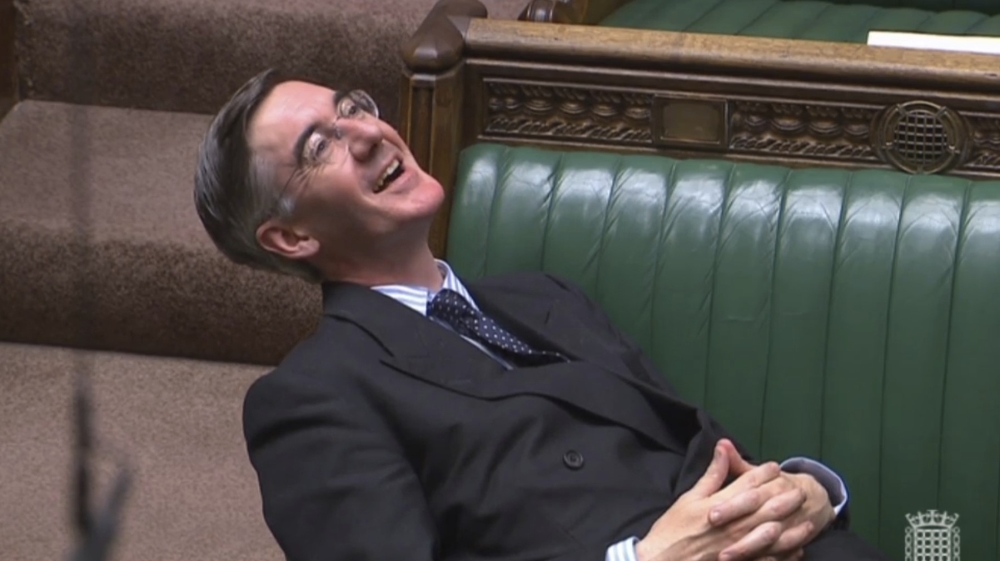 Britain's Leader of the House of Commons Jacob Rees-Mogg reclines on his seat in the House of Commons, London, Tuesday Sept. 3, 2019. With Britain's prime minister Boris Johnson weakened by a major de