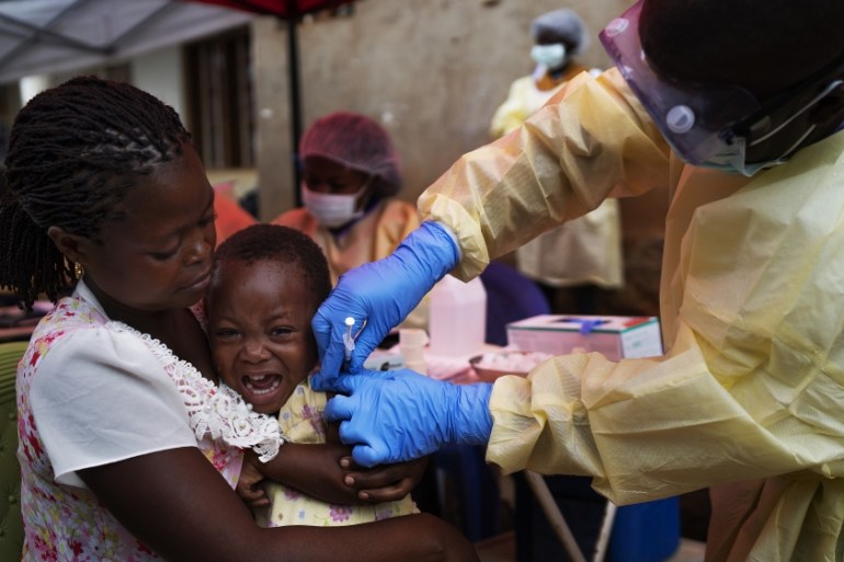 In this Saturday, July 13, 2019 file photo, a child is vaccinated against Ebola in Beni, Congo