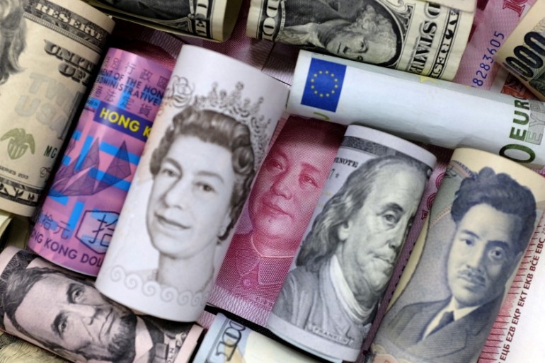 Euro, Hong Kong dollar, U.S. dollar, Japanese yen, pound and Chinese 100 yuan banknotes are seen in this picture illustration