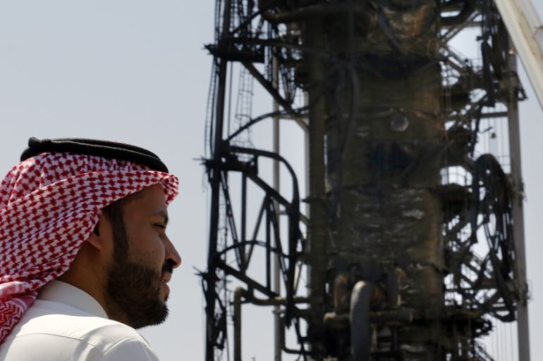 n this photo opportunity during a trip organized by Saudi information ministry, a man watches the damaged in the Aramco''s Khurais oil field, Saudi Arabia, Friday, Sept. 20, 2019