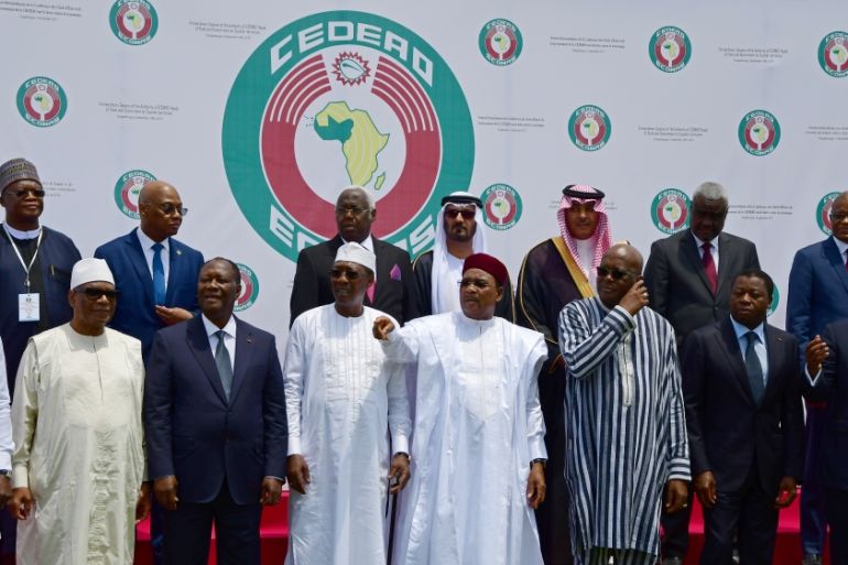 West African leaders and officials stand for a family photo at the ECOWAS extraordinary summit on terrorism in Ouagadougou