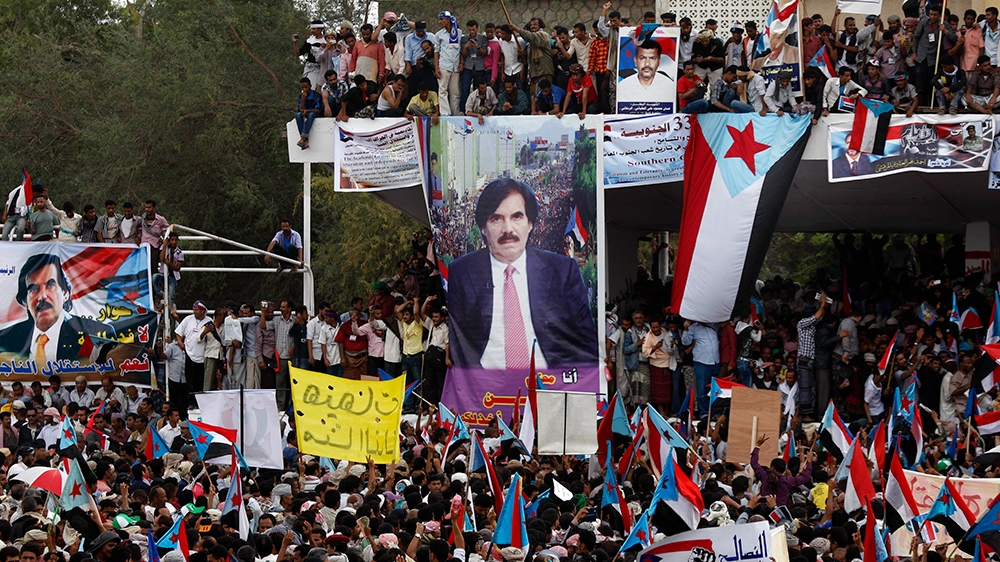 Yemeni supporters of the Southern Separatist Movement hold former South Yemen flags during a rally in Aden, Yemen, Sunday, Jan. 13, 2013. The rally commemorates the anniversary of a civil war that bro
