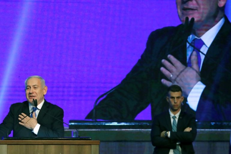 Israeli Prime Minister Benjamin Netanyahu gestures at the Likud party headquarters in Tel Aviv