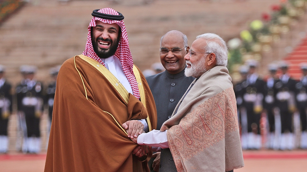 FILE - In this Feb. 20, 2019 file photo, Saudi Arabia's Crown Prince Mohammed bin Salman shakes hand with Indian Prime Minister Narendra Modi during a ceremonial welcome in New Delhi, India. Amid the 