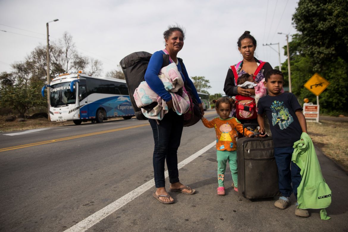 Marielis Gonzales, 42, her 22- and 8-year-old children, 3-year-old and 3-month-old grandchildren from Caracas, Venezuela being their trek to Medelli´n, Colombia where she said her son waits for them.