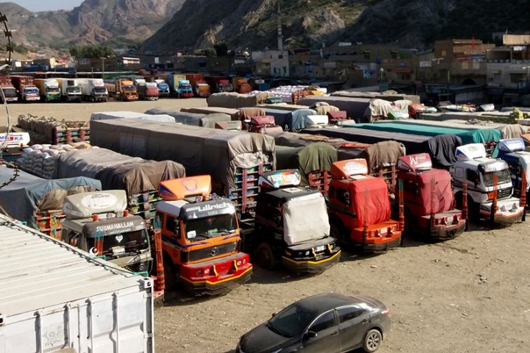 Trucks are parked at Pakistan-Afghanistan border Torkham, Friday, Oct. 19, 2018. Pakistan closed its two official border crossings with Afghanistan, the foreign ministry said. The development came at