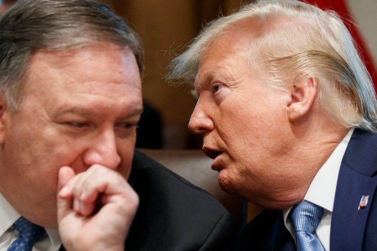 Secretary of State Mike Pompeo, left, and President Donald Trump whisper during a Cabinet meeting in the Cabinet Room of the White House, Tuesday, July 16, 2019, in Washington. (AP Photo/Alex Brandon)