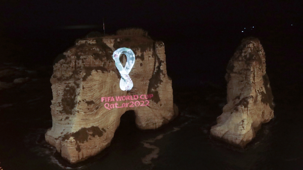 The Fifa World Cup Qatar 2022 logo is projected on the famous Pigon's Rock landmark in the Lebanese capital Beirut on September 3, 2019.  Anwar AMRO / AFP