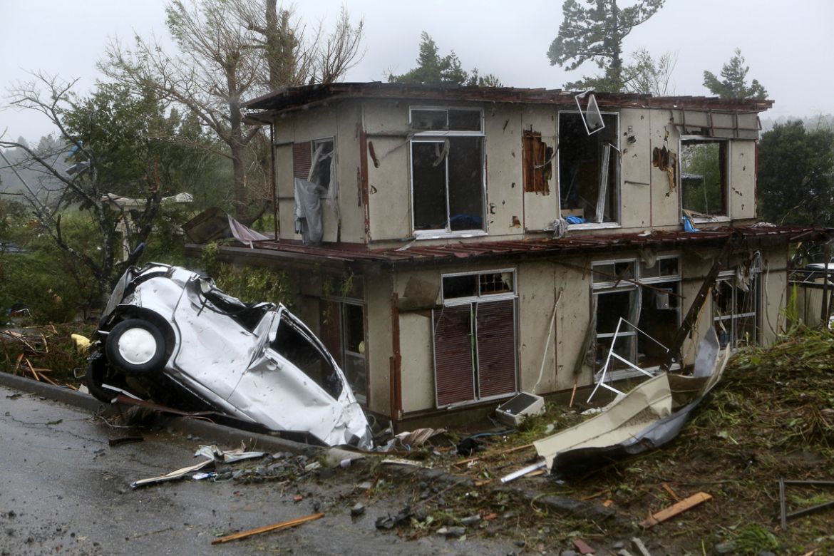 A view of a damaged vehicle and house after a tornado caused by typhoon Hagibis hit Ichihara, Chiba Prefecture, east of Tokyo, 12 October 2019. Tyhoon Hagibis is expected to make landfall on the Pacif