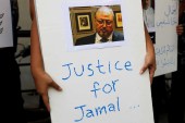 A journalist holds a placard during a protest over the killing of Saudi journalist Jamal Khashoggi in front of the Saudi embassy in Jakarta, Indonesia, on October 19, 2018 [Reuters/Beawiharta]
