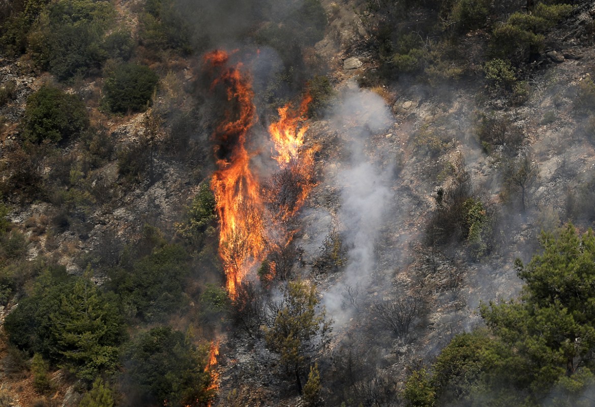 Blazes billow after fires broke out around the village of Meshref in Lebanon''s Shouf mountains, southeast of the capital Beirut, on October 15, 2019. - Flames devoured large swaths of land in several