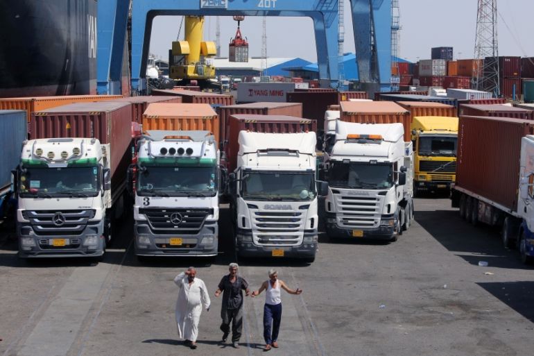 Trucks are seen at Umm Qasr port near Basra