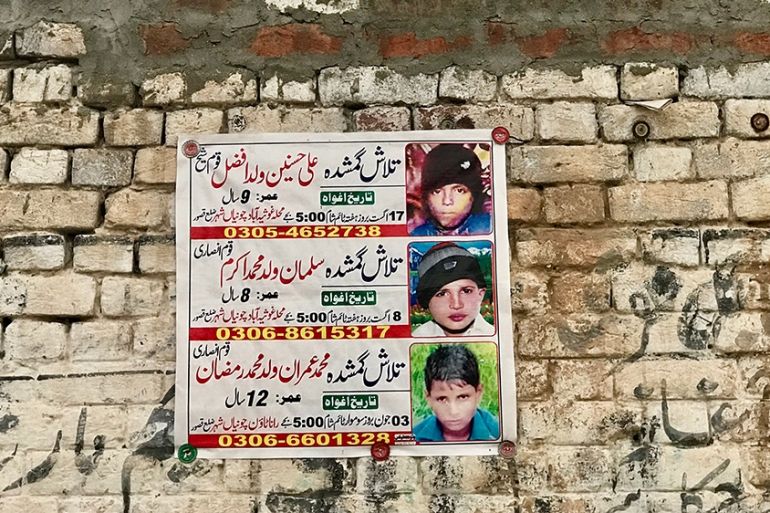 Posters with photos of missing children are still pasted on walls around Chunian, Pakistan, where four boys were found dead after being kidnapped and raped [Zehra Abid/Al Jazeera]