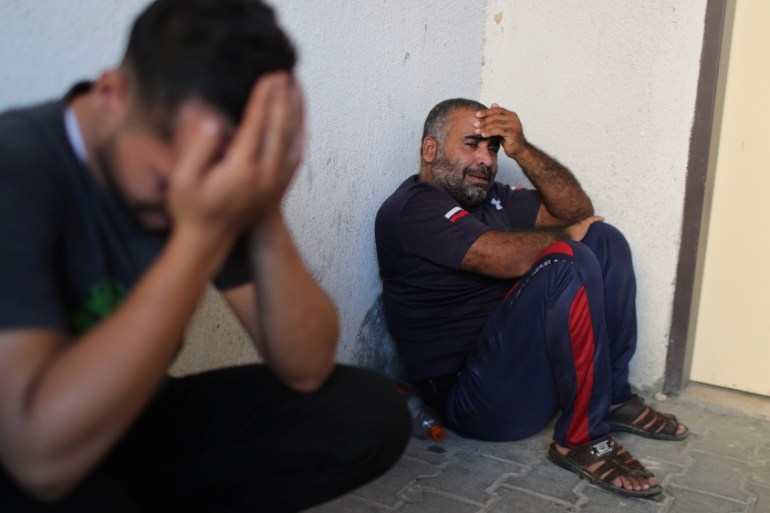 Relatives of a Palestinian who was killed at the Israeli-Gaza border fence, react at the hospital in the northern Gaza Strip