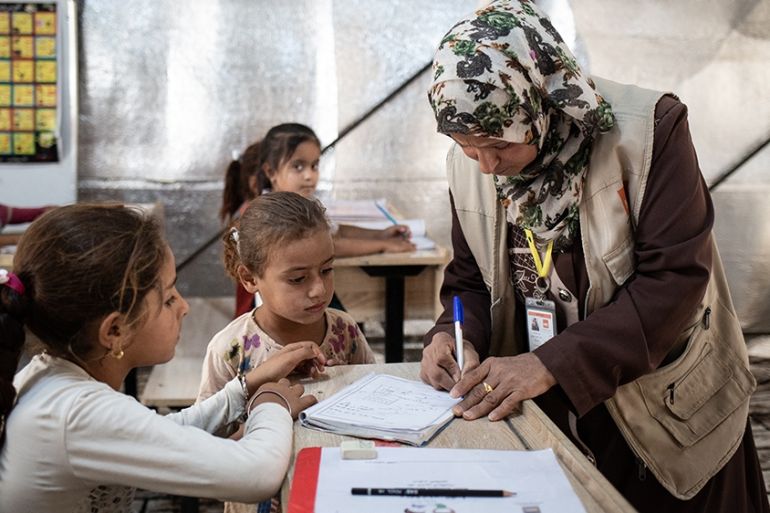 Eman, a volunteer teacher giving lessons in Hamam al Alil camp near Mosul [Tom Peyre-Costa/NRC]