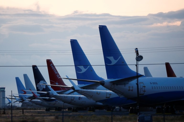 The tails of Boeing 737 MAX aircraft are seen parked at Boeing facilities at the Grant County International Airport in Moses Lake