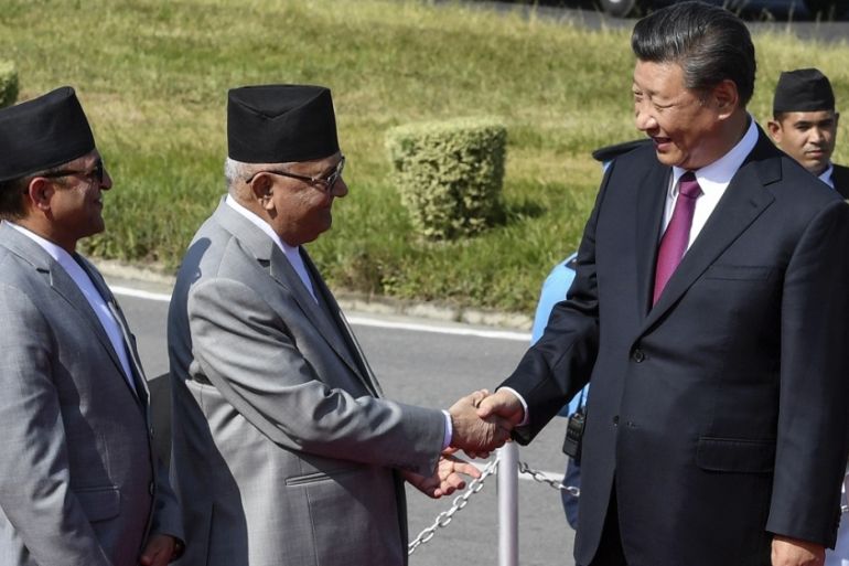 China''s President Xi shakes hands with Nepal''s PM Oli in Kathmandu