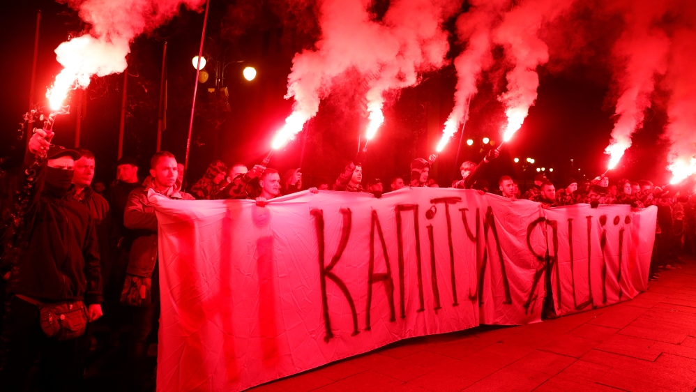 Activists of far-right parties take part in a rally against approval of so-called Steinmeier Formula, in Kiev