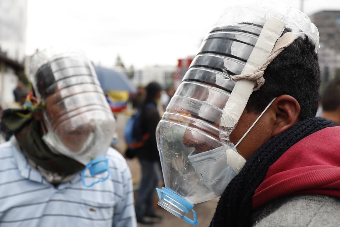 People use homemade gas masks made by Cesar Viteri in Quito, Ecuador, 10 October 2019. Viteri designed his own masks with reused plastic due the need to face tear gases during the clashes in Ecuador''s