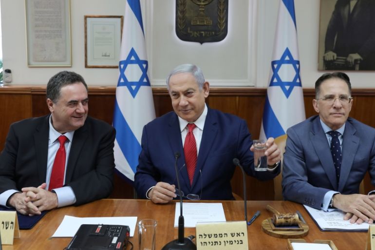 Israeli Prime Minister Benjamin Netanyahu, Foreign Minister Israel Katz and Government Secretary Tzachi Braverman attend the weekly cabinet meeting in Jerusalem