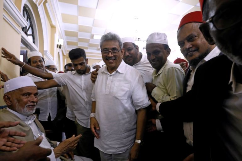 Sri Lanka''s former wartime defense secretary and presidential candidate Rajapaksa shares a moment with Muslims during his visit at Ketchimale mosque in Beruwala