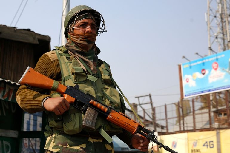 An Indian paramilitary soldier stands guard in Srinagar, the summer capital of Indian Kashmir, 30 October 2019. Five non-local laborers were killed and another injured by suspected militants in south