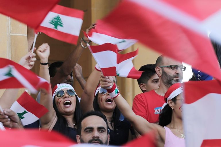 Anti-government protesters shout slogans against the Lebanese government during a protest in Beirut, Lebanon, Monday, Oct. 21, 2019. Lebanon’s Cabinet approved Monday sweeping reforms that it hopes wi