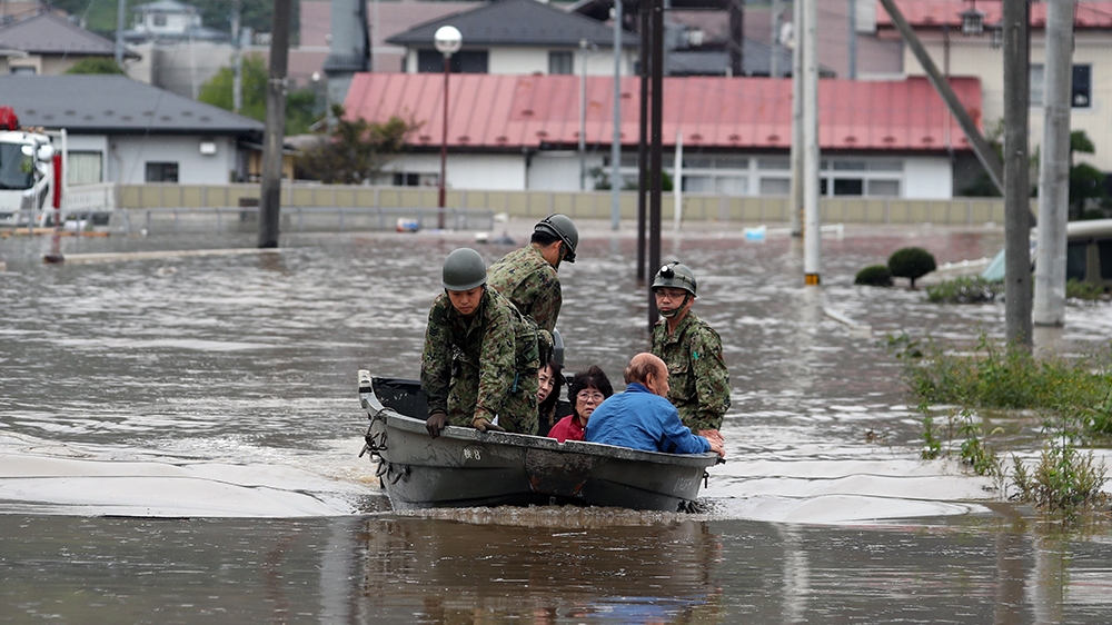 Residents are rescued by Self-Defense Forces in Marumori, Miyagi prefecture, Japan, 14 October 2019. According to latest media reports, at least 37 people have died and 17 are still missing after powe