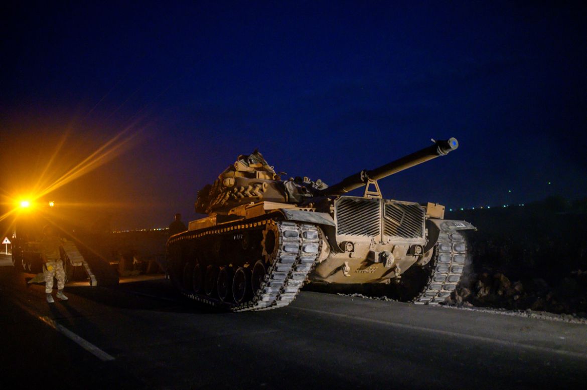 A Turkish army''s tank drives towards the border with Syria near Akcakale in Sanliurfa province on October 8, 2019. - Turkey said on October 8, 2019, it was ready for an offensive into northern Syria,