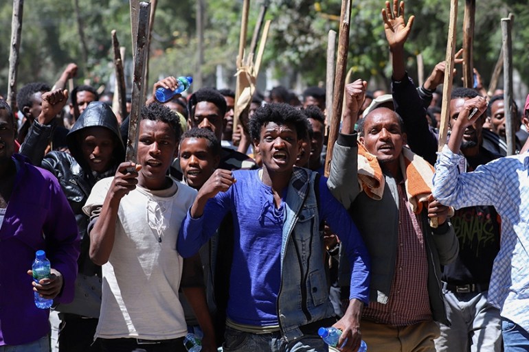 Oromo youth chant slogans during a protest in-front of Jawar MohammedO~s house, an Oromo activist and leader of the Oromo protest in Addis Ababa, Ethiopia, October 24, 2019. REUTERS/Tiksa Negeri