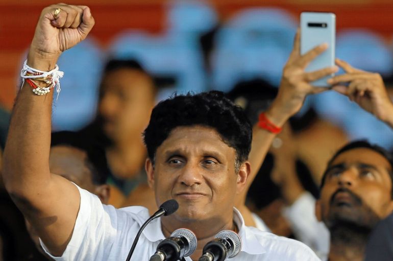 Sajith Premadasa, Sri Lanka''s Housing Minister and the presidential candidate of the United National Party (UNP)-led New Democratic Front gestures at his supporters during his first election campaign