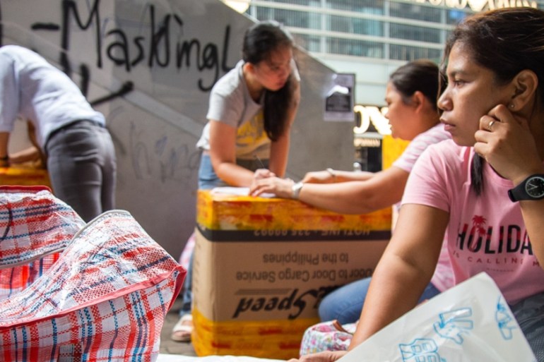 Women pack boxes to ship back to the Philippines on Oct. 7, 2019 in Central, Hong Kong’s business district and site of numerous anti-government protests over the past four months.