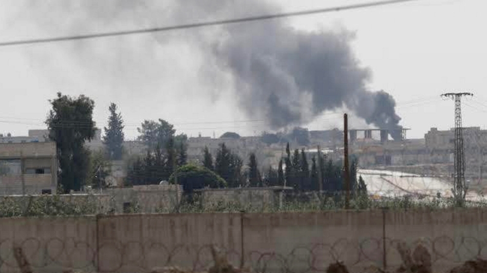 Smoke rises in the Syrian border town of Tel Abyad, as seen from Akcakale