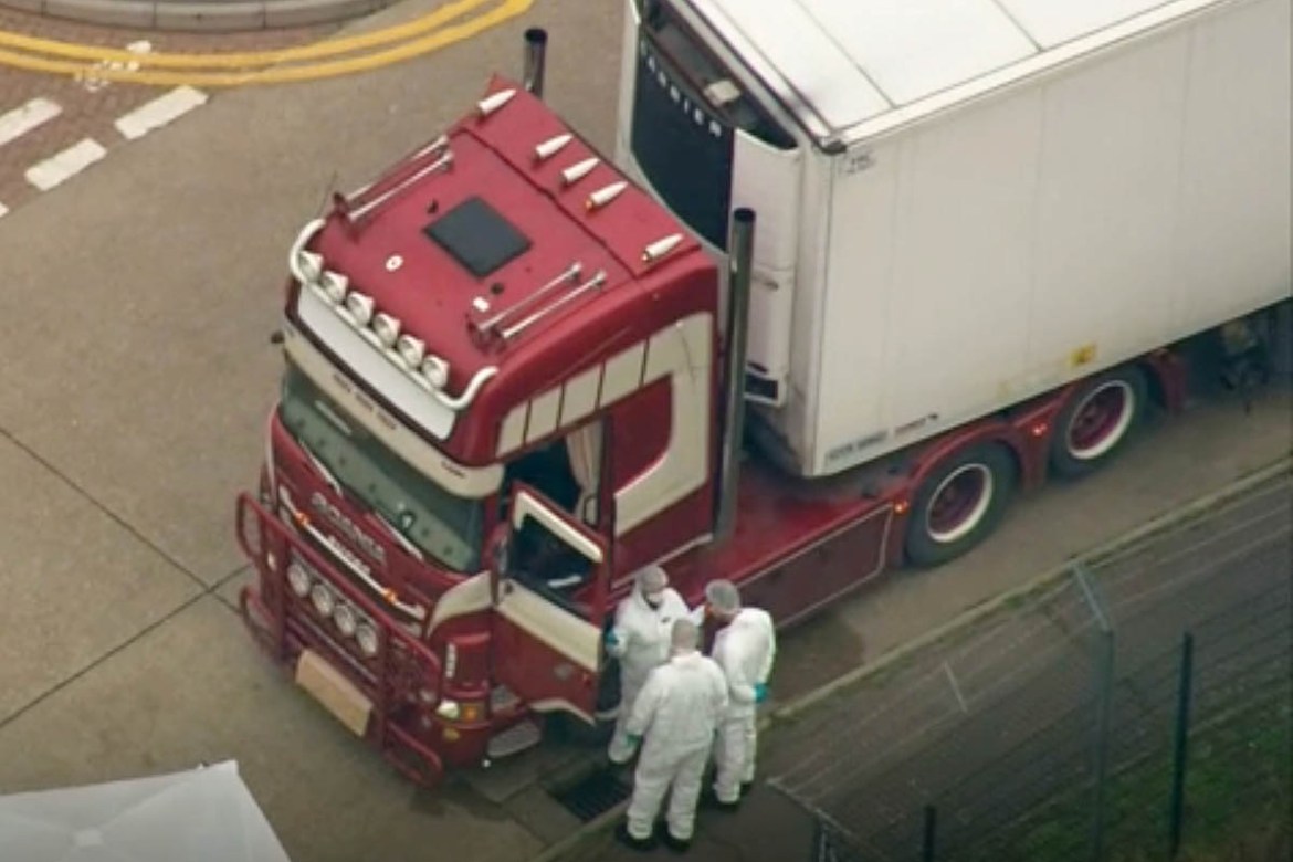 An aerial view as police forensic officers attend the scene after a truck was found to contain a large number of dead bodies, in Thurrock, South England, early Wednesday Oct. 23, 2019. Police in south
