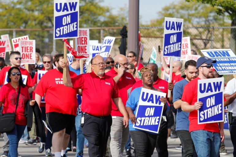 Striking United Auto Workers (UAW) walk the picket line in Hamtramck