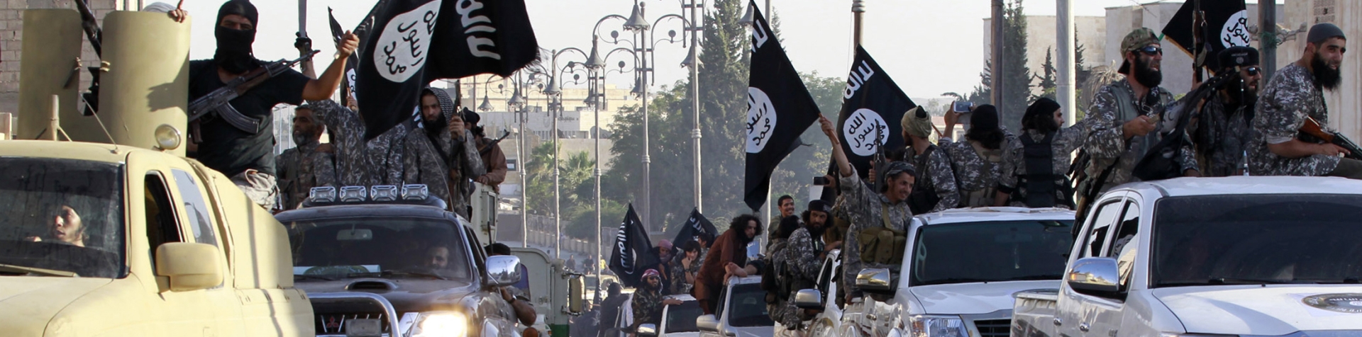 ISIL fighters celebrating the declaration of the so-called 'caliphate' in Raqqa province in June 2014 [File: Reuters]